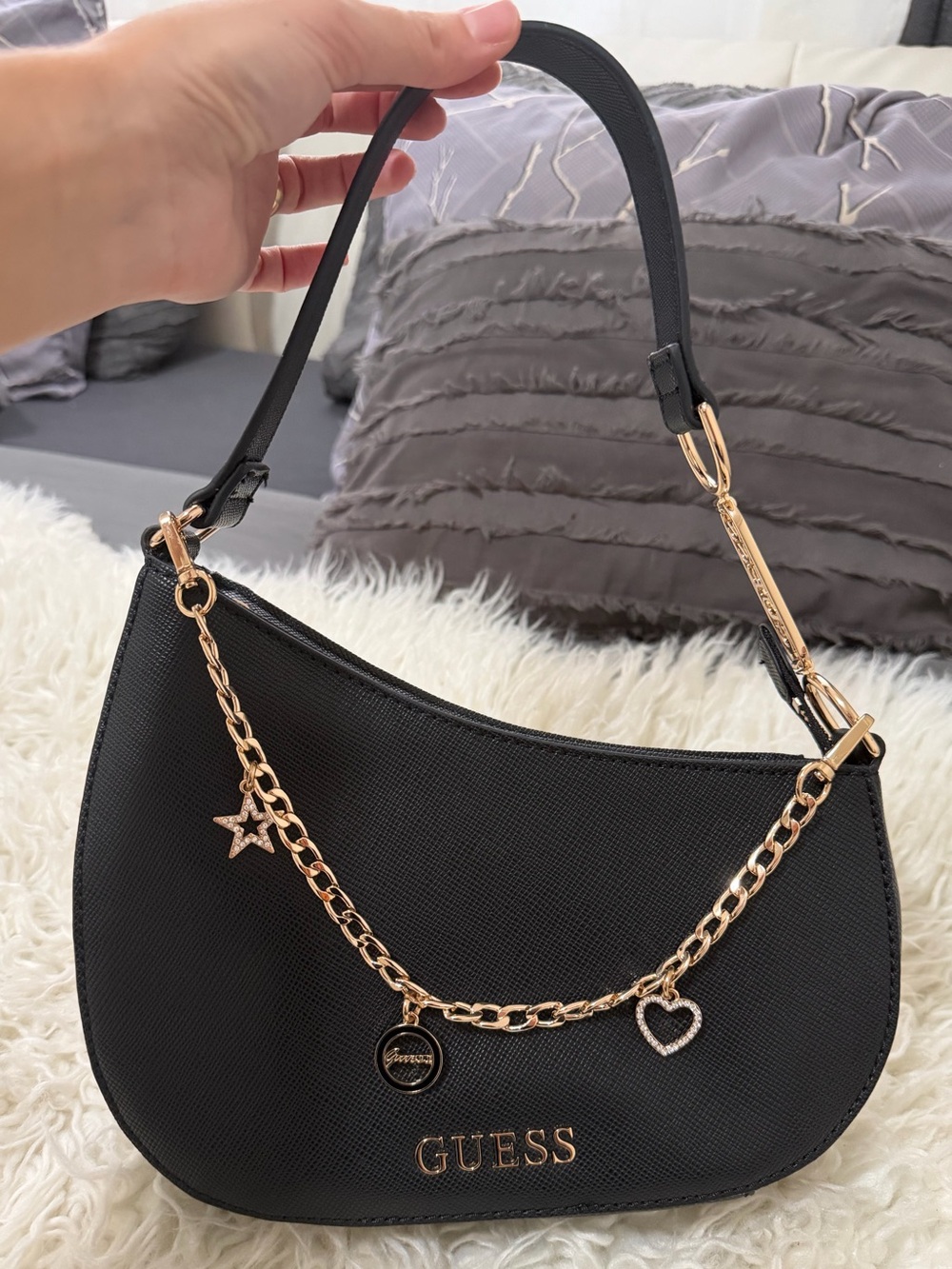 GUESS Black Crescent Shoulder Bag with Gold Charm Chain Accents